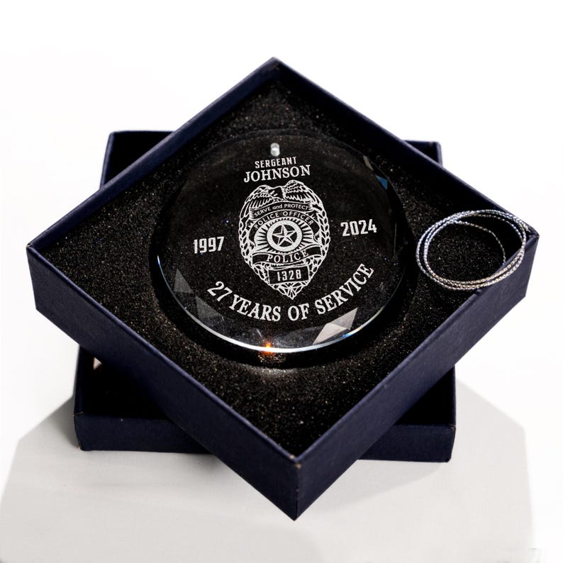 This custom retirement ornament, a Personalized Police Retirement Glass Ornament, is a unique police officer gift.