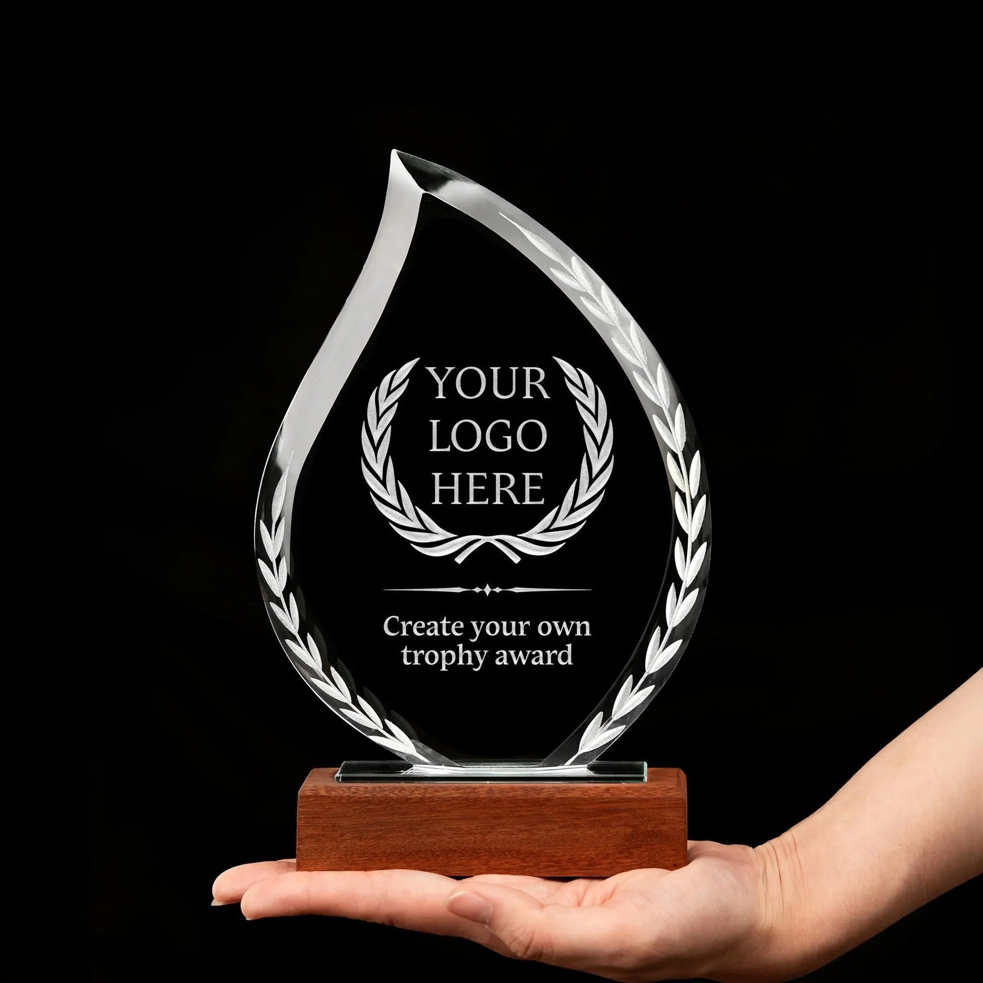 Bulk corporate gifts featuring flame-shaped crystal awards with custom logos  