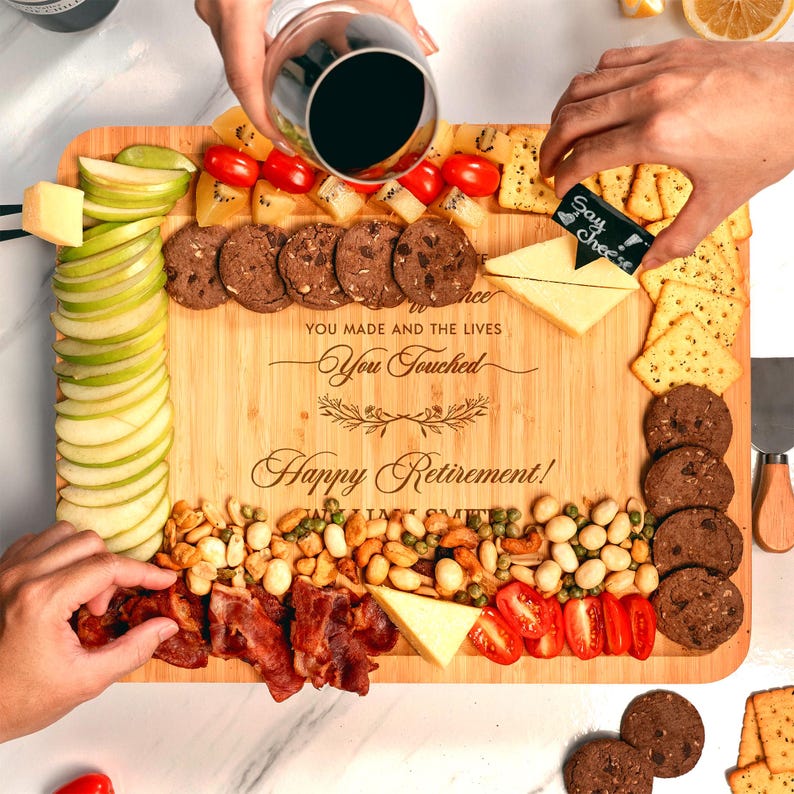 Custom engraved charcuterie board made of bamboo, a memorable and personalized retirement gift idea.