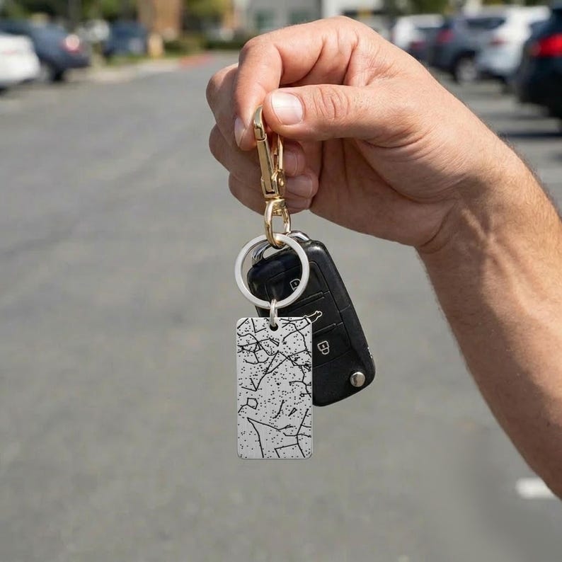 Engraved key ring with a custom constellation star map gift design, a premium personalized metal keychain for him.