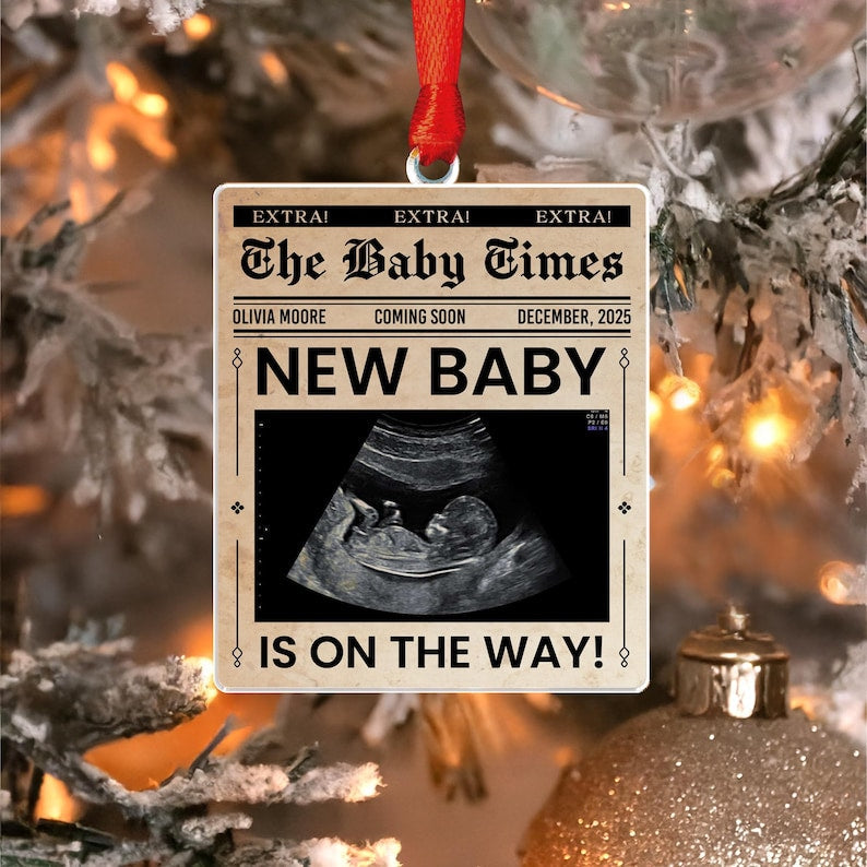 Close-up of a personalized Christmas ornament, the Personalized Ultrasound Newspaper Acrylic Ornament features the baby's ultrasound photo.