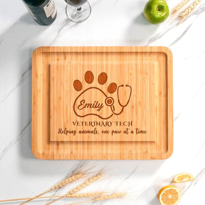A custom-made Personalized Veterinary Tech Bamboo Charcuterie Board, a unique gift idea for a new veterinarian or vet nurse.