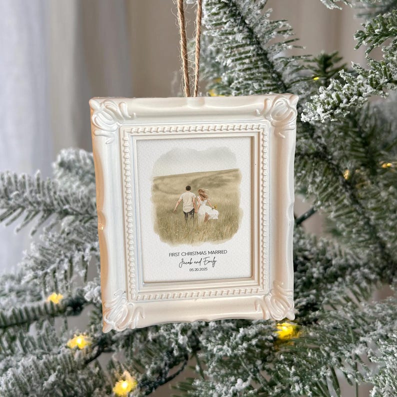 A close-up of a Mr. and Mrs. Christmas ornament, the Personalized Watercolor Photo First Christmas Married Frame Ornament is a cherished keepsake.
