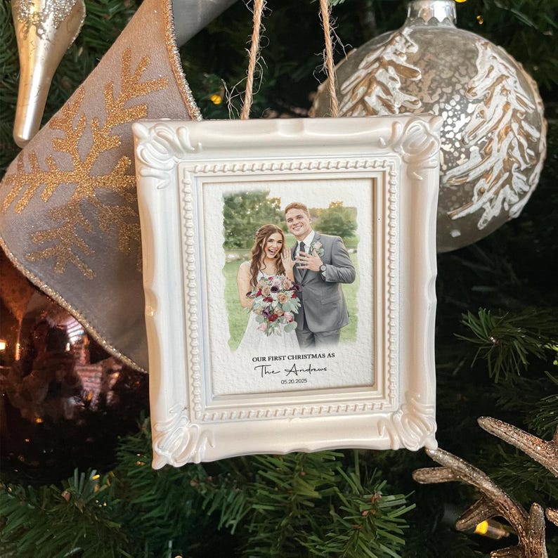 The ideal newlywed Christmas ornament, this Personalized Watercolor Photo Our First Christmas Frame Ornament is a unique custom photo ornament.
