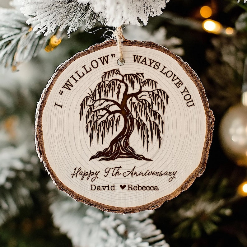 A close-up of an engraved Personalized Willow Tree Anniversary Wooden Ornament, an ideal 9th-anniversary gift.